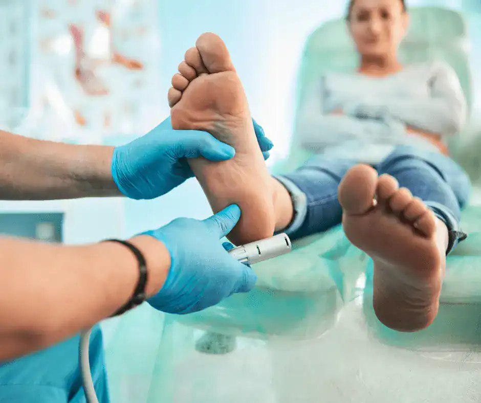 podiatrist looking after patient feet