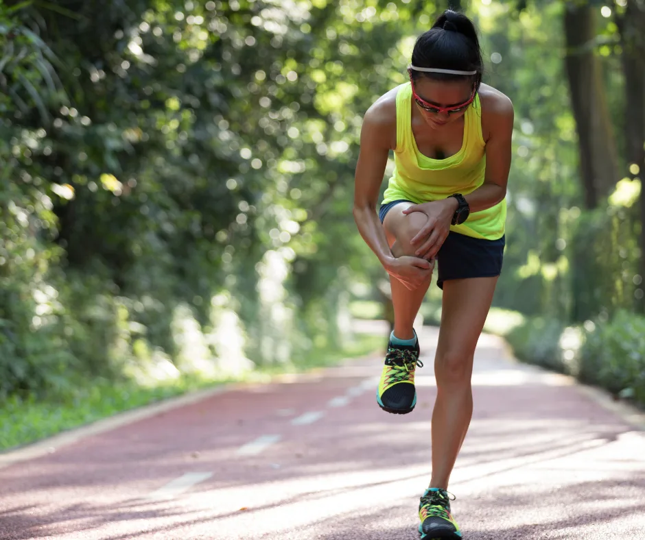 woman holding her leg in pain due to shin splints